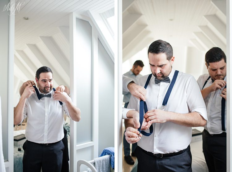 Groomsmen fit suspenders as part of their wedding outfits