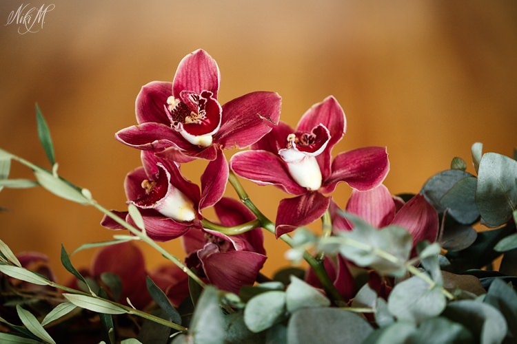 Burgundy red orchids as wedding flowers