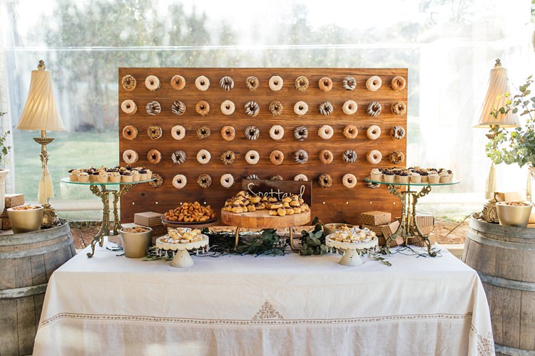 The most gorgeous dessert table with a doughnut buffet board