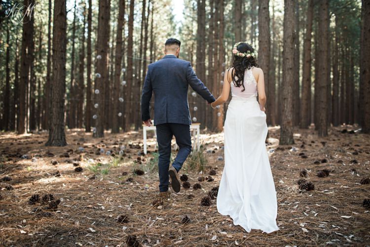 Amy and Silvino make their way through the forest to a communion table