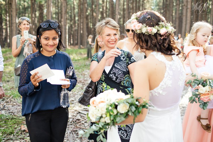 Guests congratulate the bride in the forest