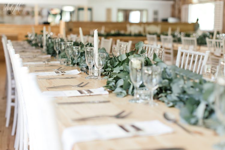 Simple and classic wedding decor at Assegaibosch in the Langkloof with a Eucalyptus leaf runner
