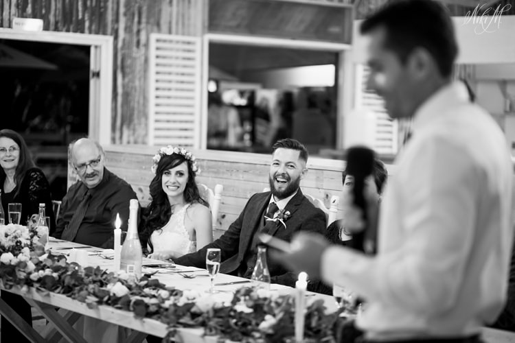 Silvino giggles during a speech by his groomsman