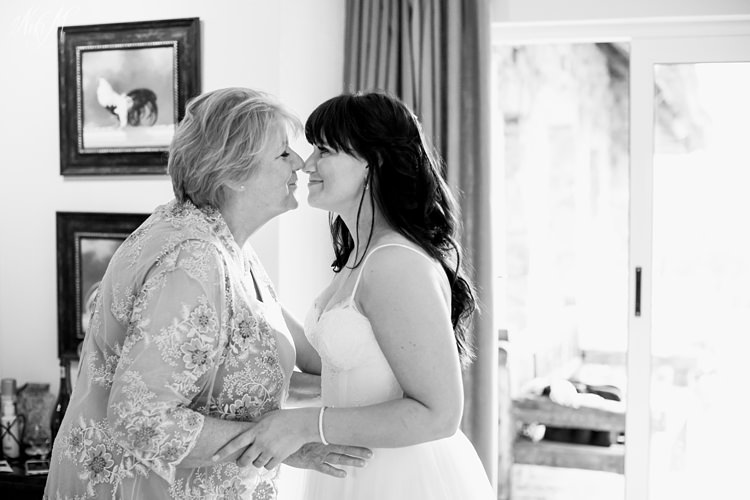 Vanessa and her mom share a sweet moment before the wedding ceremony